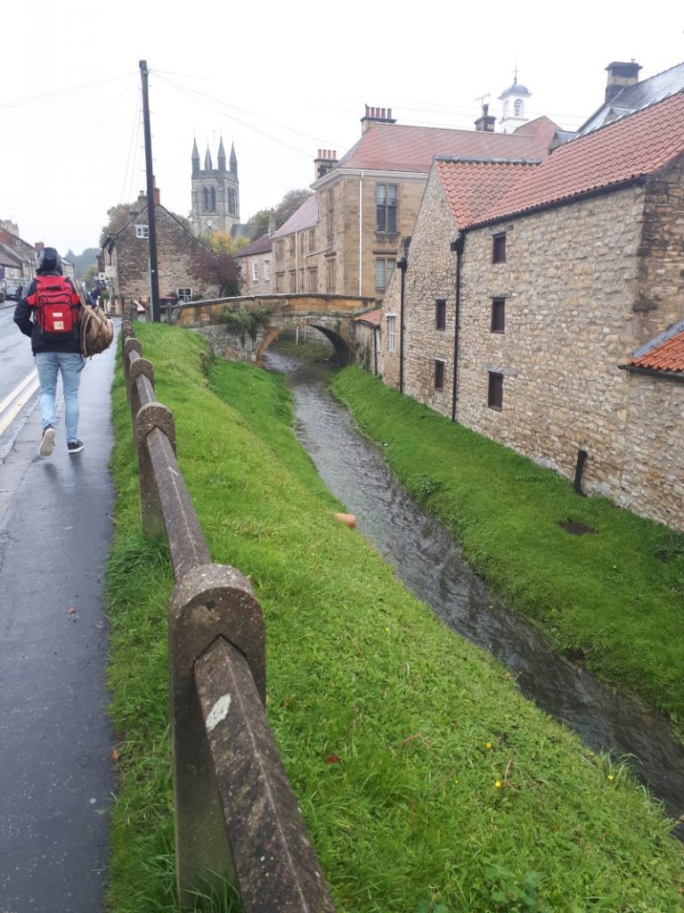 Helmsley on a rainy day in October 2019. Borough Beck running behind the main square.